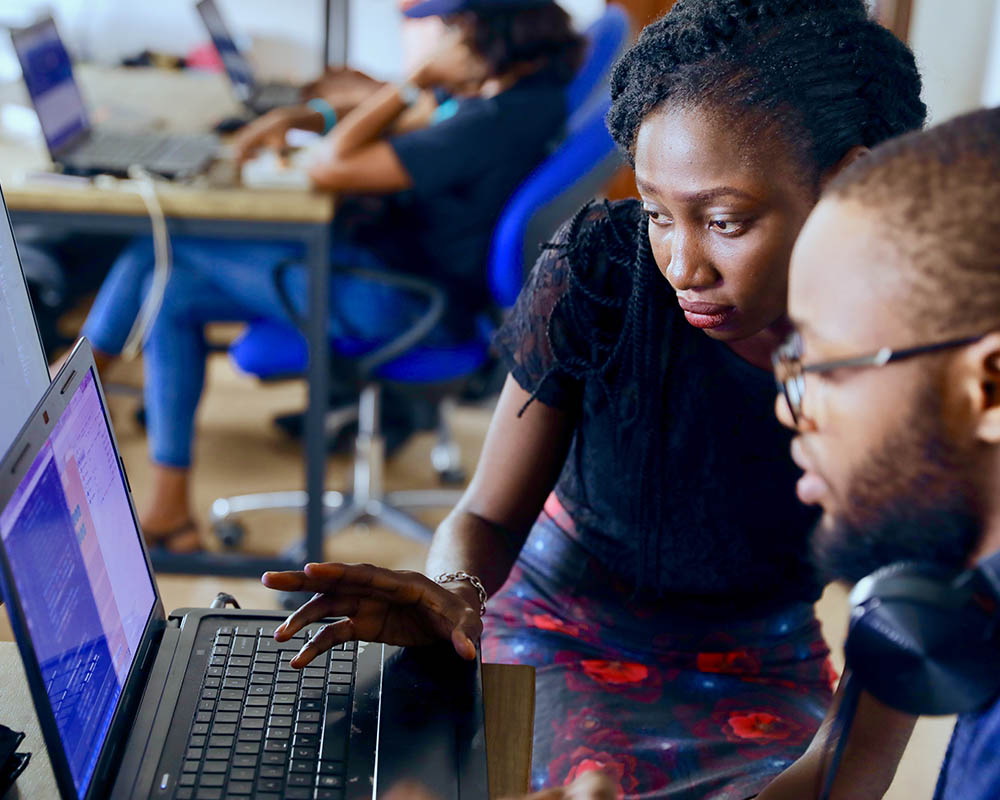 People looking at computer
